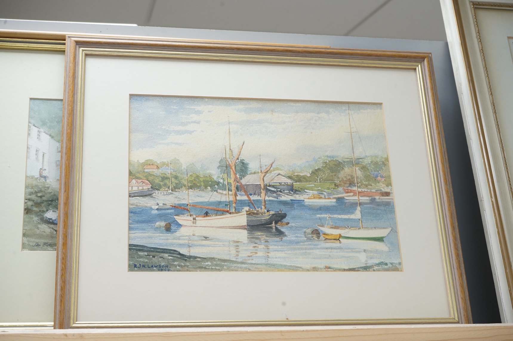 Jim Birt (20th. C), watercolour, Cornish town scene with beached fishing boats, together with R J N Lawson, a similar watercolour dated 1948, 19 x 27cm